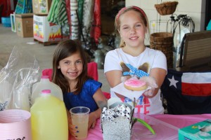 Mia (left) and Ana Yoch of Murphy sold lemonade and frosted sugar cookies outside of the Kroger at Los Rios and !4th St. May 2. The girls  participated in the Lemonade Day event to raise money.