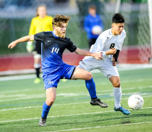 Oladipo Awowale/MurphyMonitor Jose Martinez appears to the be on the short end of this encounter with Byron Nelson’s Cole McPherson during last Friday’s bi-district match at Flower Mound High School. 