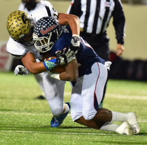 Plano East's Anthony Hines, one of the nation's high school linebackers, brings down a Denton Ryan player during the 2015 bi-district playoffs.