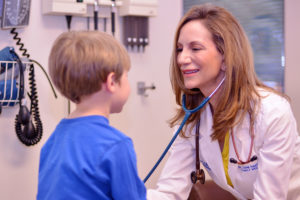 Dr. Sadler’s kind demeanor puts her young patient at ease.