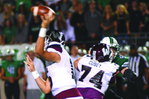 Parker Cusey (74) provides pass protection for Wylie quarterback Emilio Ames during Friday's 28-3 bi-district loss at Southlake Carroll. Cusey is currently hospitalized and being treated for stroke-like symptoms following the contest.