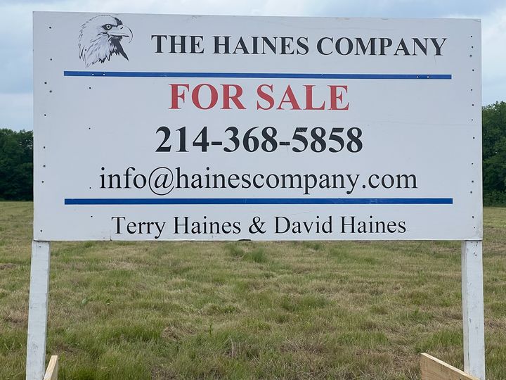 “For Sale” sign posted near disputed development